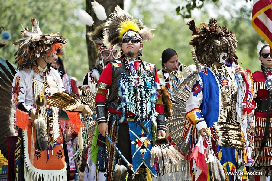 Pictured: Members of the Kahnawake Tribe attend a yearly powwow